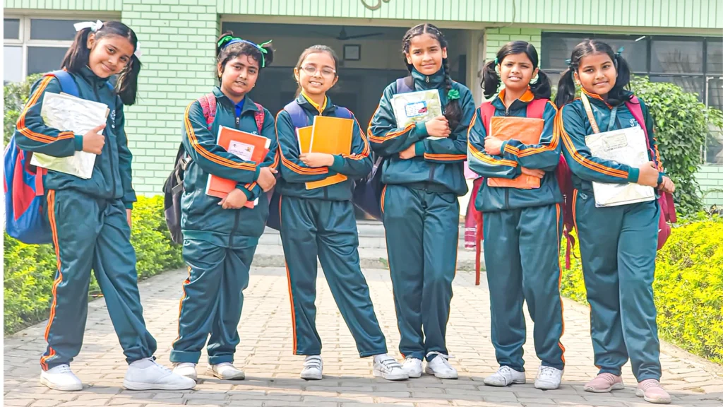 Students holding note books at the best school in Birgunj, Nepal